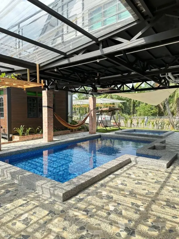 Covered pool area with hammocks