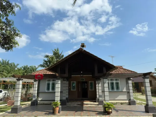 Front of the family house with a tiled roof