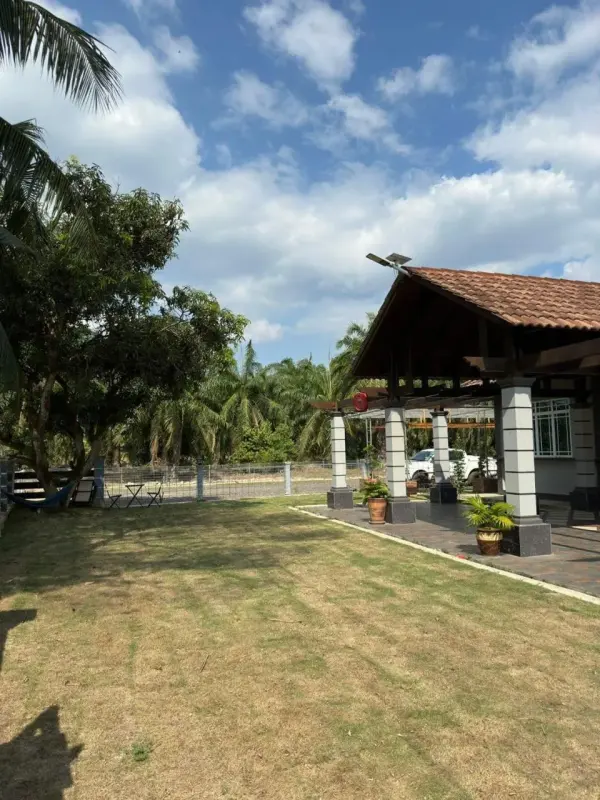 Open lawn beside a covered gazebo